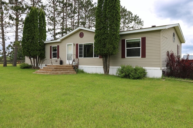 view of front of property with a front lawn