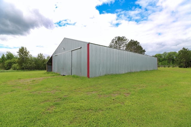 view of outbuilding with a lawn