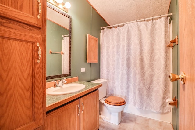 full bathroom with vanity, toilet, shower / tub combo, and a textured ceiling