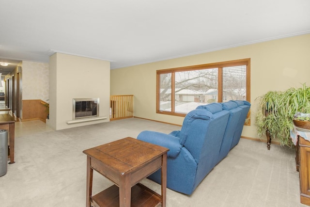 carpeted living room featuring crown molding