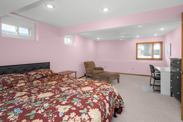 bedroom with multiple windows and light colored carpet