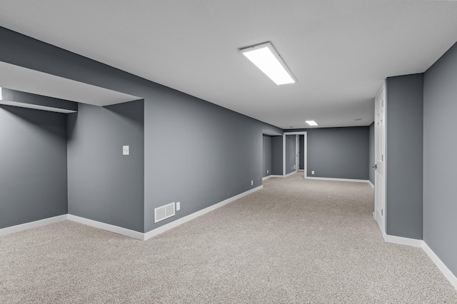 basement with light colored carpet