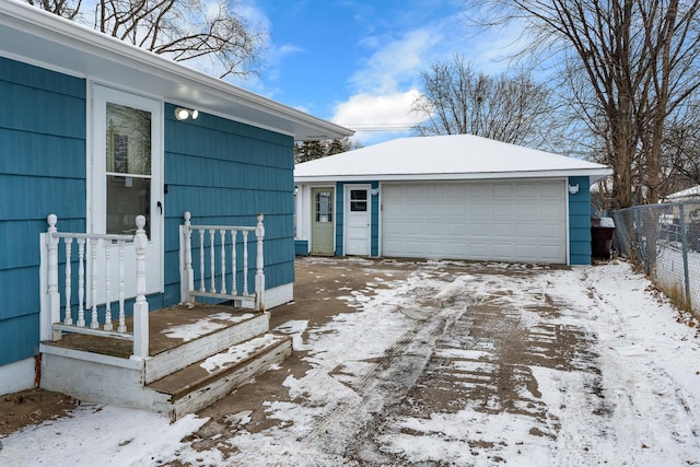 view of snow covered garage