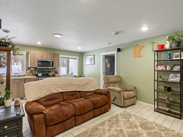 tiled living room with a textured ceiling