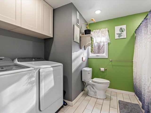 laundry room featuring independent washer and dryer and light tile patterned floors