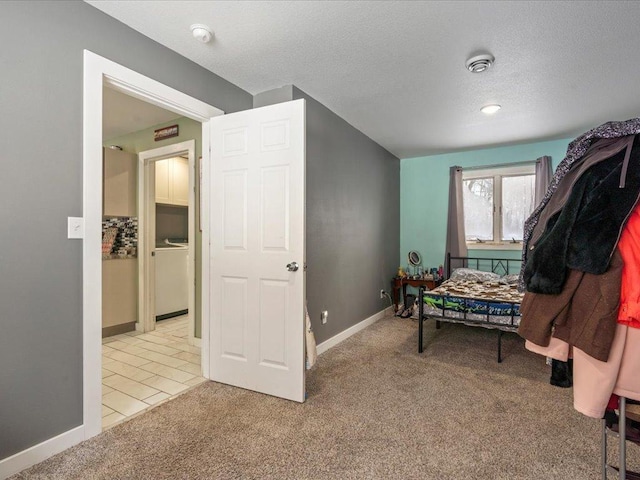 interior space with light colored carpet and a textured ceiling