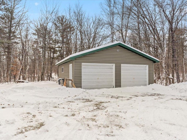 view of snow covered garage