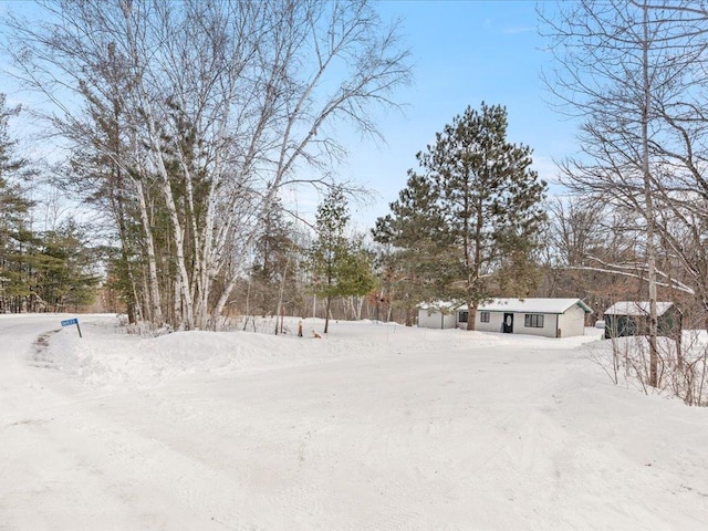 view of yard layered in snow