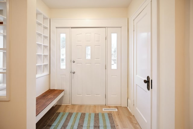 foyer entrance with wood-type flooring