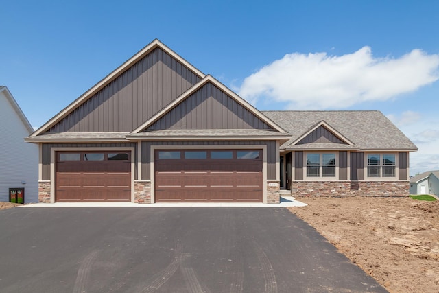 craftsman-style home with a garage