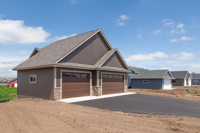 craftsman inspired home with a garage