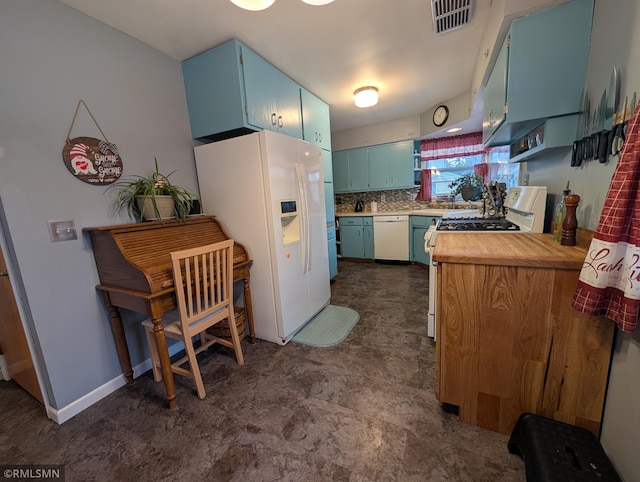 kitchen with blue cabinetry, white appliances, and decorative backsplash