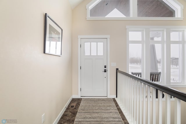 entryway featuring lofted ceiling