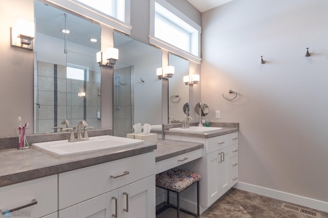 bathroom featuring vanity and an enclosed shower