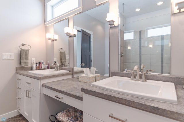 bathroom featuring vanity and a tile shower