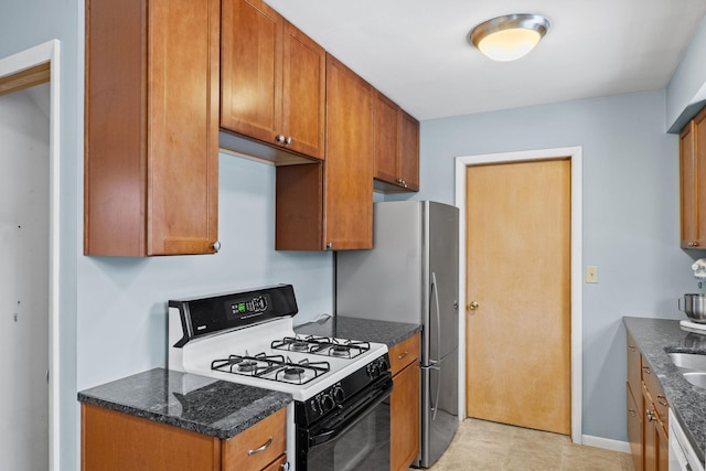 kitchen with stainless steel fridge, gas range oven, and dishwasher