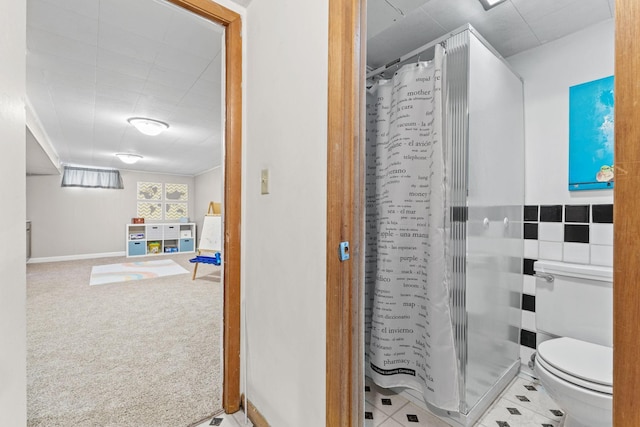 bathroom with toilet and walk in shower