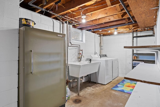 washroom featuring independent washer and dryer and sink