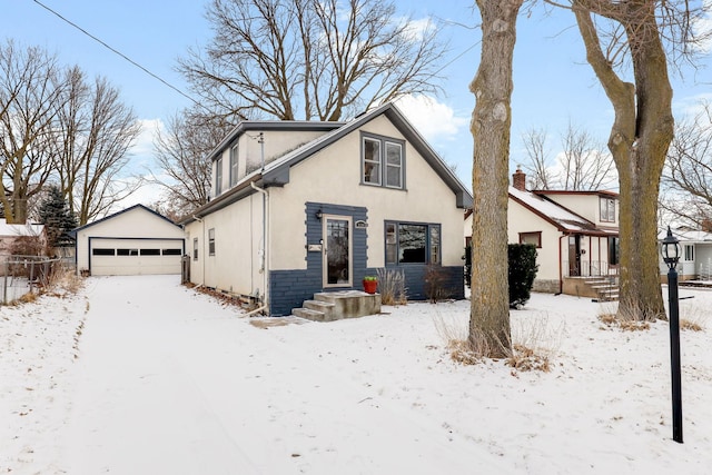 view of front of home with an outbuilding and a garage