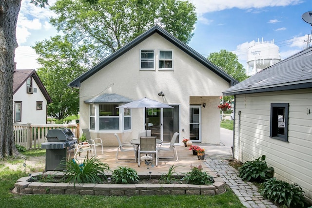 back of property with a patio