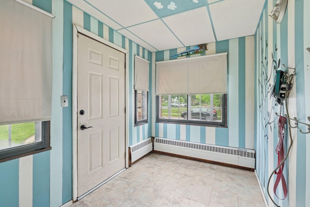 5801 23rd Ave S, Minneapolis, MN 55417 - entrance foyer with wallpapered walls and a baseboard radiator