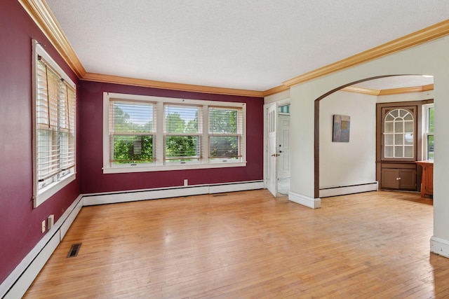 5801 23rd Ave S, Minneapolis, MN 55417 - spare room with crown molding, a baseboard radiator, arched walkways, and wood-type flooring
