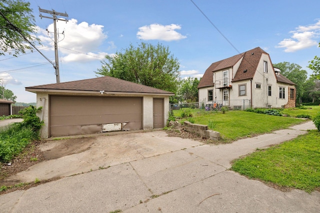 5801 23rd Ave S, Minneapolis, MN 55417 - view of property exterior with a garage, an outdoor structure, and stucco siding