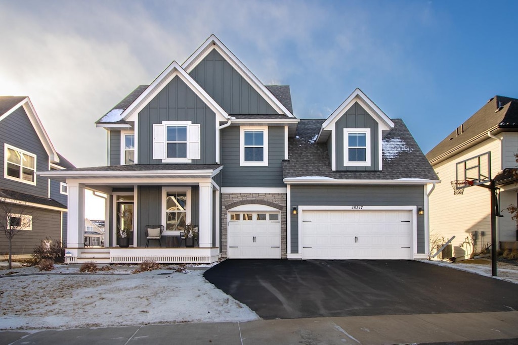 view of front of home featuring a garage and a porch