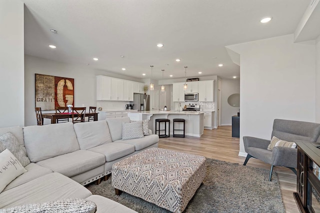 4884 Avery Ct, Eagan, MN 55123 - living room featuring light wood-style flooring, recessed lighting, and baseboards