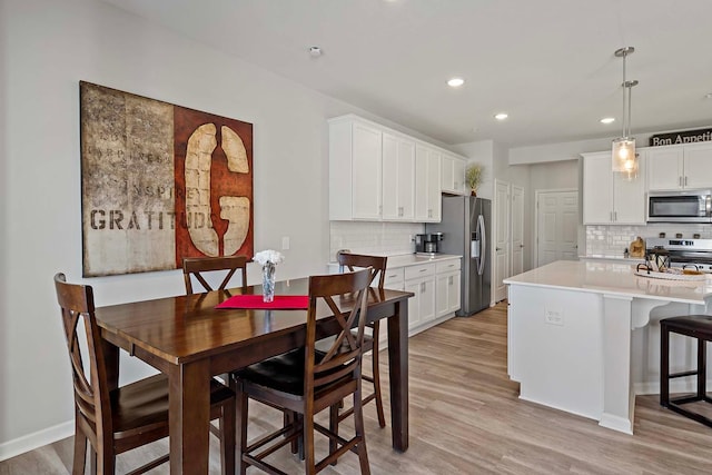 4884 Avery Ct, Eagan, MN 55123 - dining room with light wood finished floors, recessed lighting, and baseboards