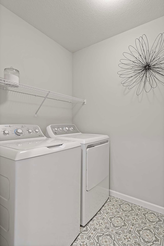 4884 Avery Ct, Eagan, MN 55123 - washroom with separate washer and dryer, baseboards, and light tile patterned flooring