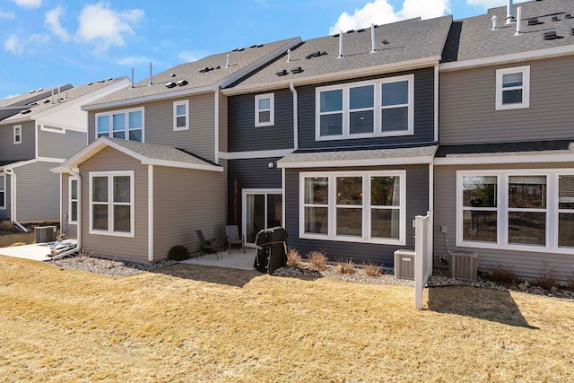 4884 Avery Ct, Eagan, MN 55123 - rear view of property featuring a patio, a yard, and central AC unit