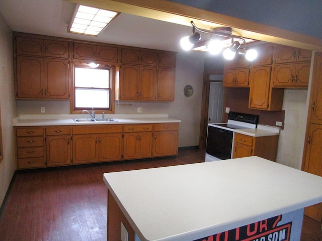 kitchen with dark hardwood / wood-style flooring, sink, a kitchen island, and electric range