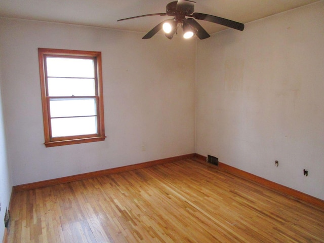 empty room featuring ceiling fan and light hardwood / wood-style flooring