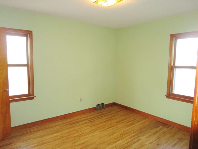 unfurnished room featuring light wood-type flooring