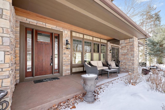 view of snow covered property entrance