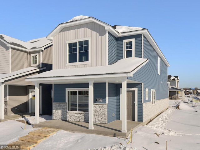 view of front of property with covered porch and board and batten siding