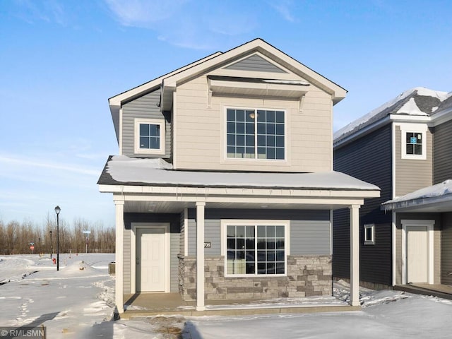 view of front of house with a porch and stone siding