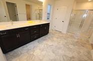 bathroom featuring vanity and an enclosed shower