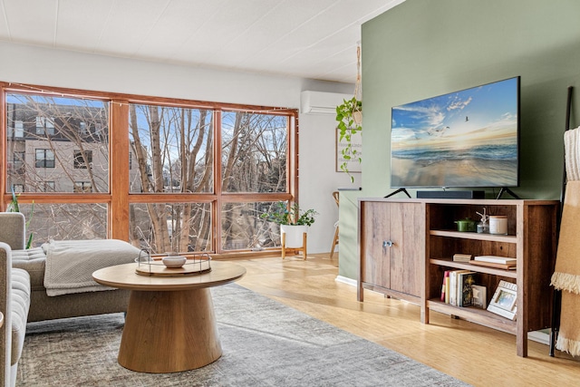 living area with wood-type flooring and a wall mounted AC