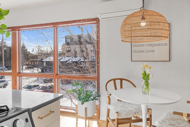 dining area featuring an AC wall unit