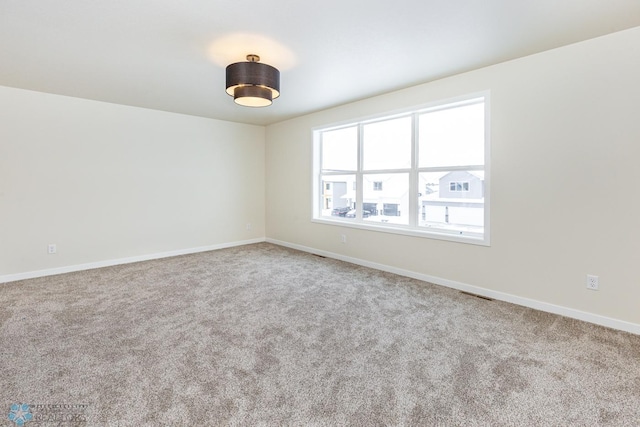 5476 Lori Ln W, West Fargo, ND 58078 - carpeted empty room featuring baseboards