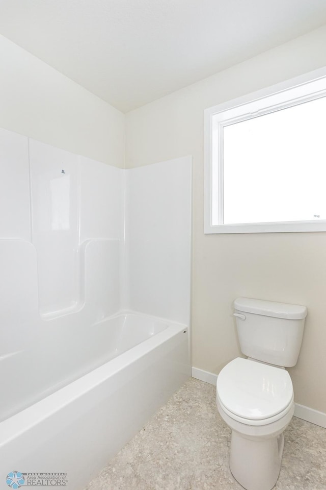 5476 Lori Ln W, West Fargo, ND 58078 - full bath with baseboards, toilet, and tub / shower combination