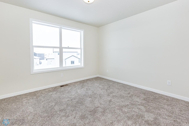 5476 Lori Ln W, West Fargo, ND 58078 - spare room featuring carpet floors and baseboards
