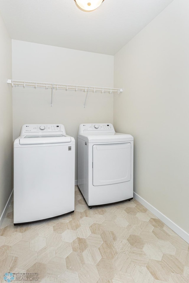 5476 Lori Ln W, West Fargo, ND 58078 - washroom with washer and clothes dryer and baseboards