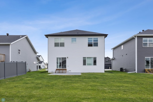 5476 Lori Ln W, West Fargo, ND 58078 - back of property featuring central AC unit and a patio area
