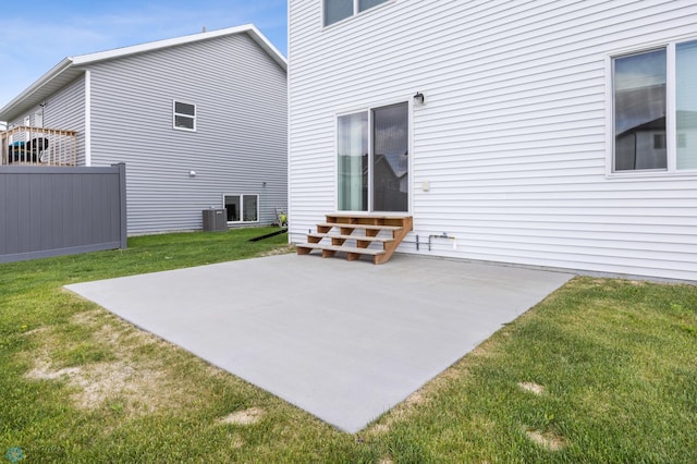 5476 Lori Ln W, West Fargo, ND 58078 - rear view of property with a patio, entry steps, a yard, and central AC