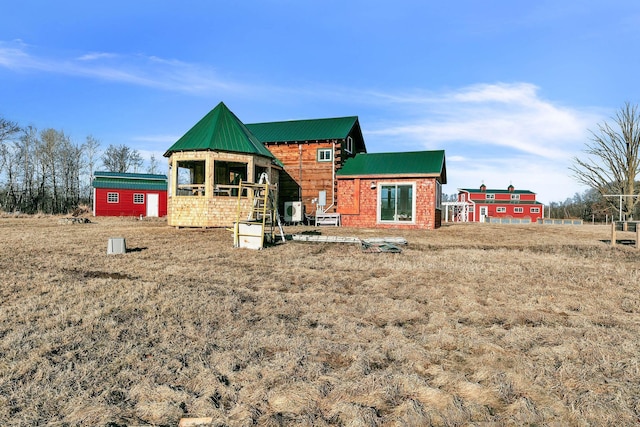 back of property with metal roof