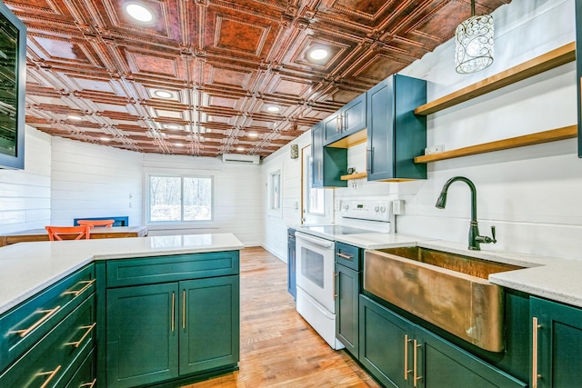 kitchen featuring open shelves, green cabinets, an ornate ceiling, white electric range, and a sink