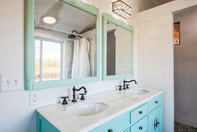 bathroom with double vanity, baseboards, a shower with curtain, and a sink